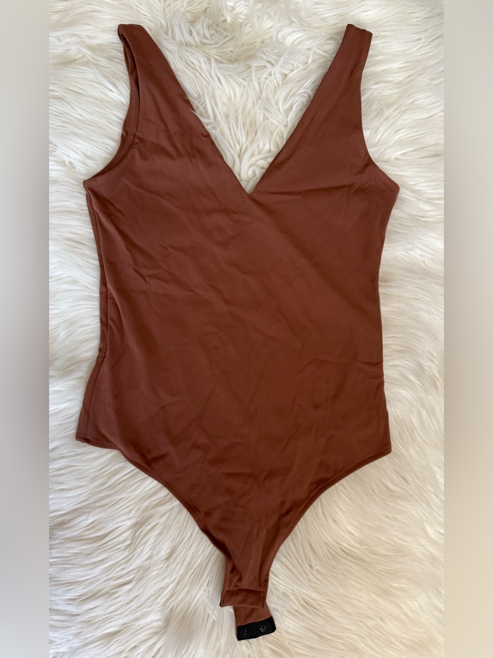 Brown v-neck one-piece bodysuit